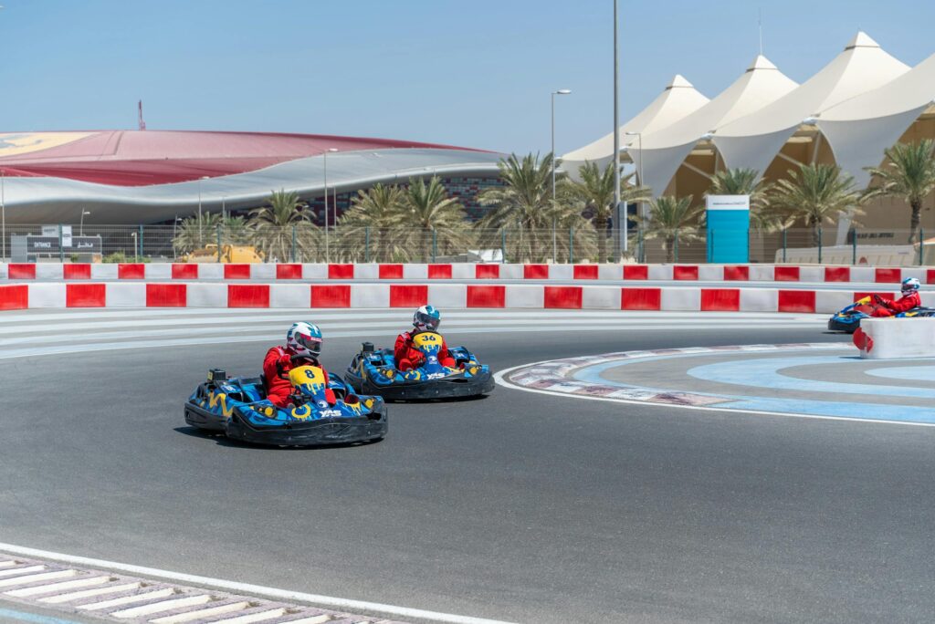 Thrilling go-kart race at Yas Marina Circuit, Abu Dhabi under the bright sunny sky.